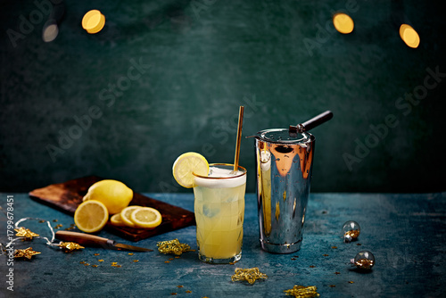 Refreshing Lemon Cocktail with Shaker and Fresh Citrus on Festive Table