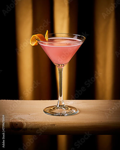 Elegant Pink Cocktail with Citrus Twist in Martini Glass