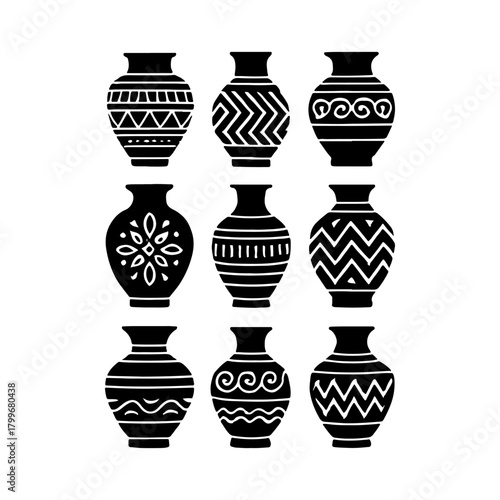 Collection of decorative black and white ceramic vases with patterns