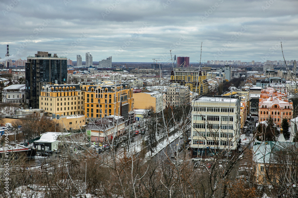 Fototapeta premium Kyiv Podil district winter cityscape with colorful buildings.