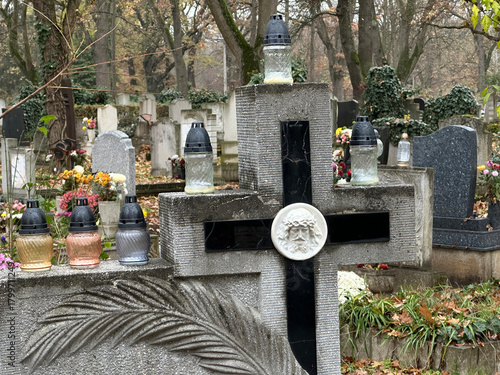 Stone cross on the tombstone in the public cemetery