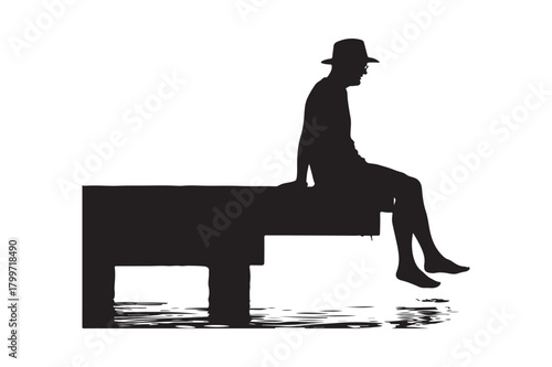 Silhouette of a person in a hat sitting on a dock overlooking water