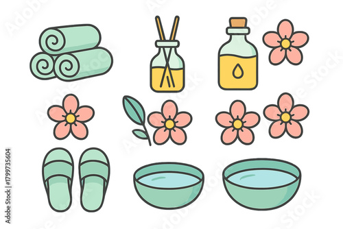 Set of spa treatment elements with rolled towels, aromatherapy diffuser, essential oil bottle, and flowers