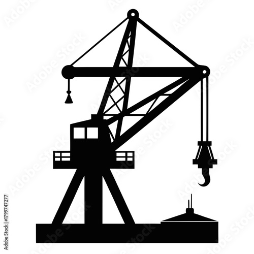 Silhouette of a large industrial crane over a submarine