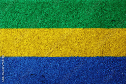 Fotografie A textured background composed of green, yellow, and blue horizontal stripes, cr