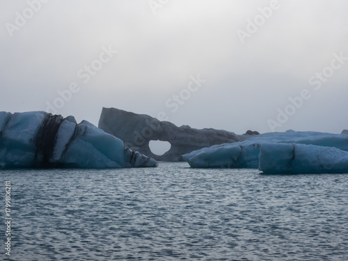 Icebergs floating in dense fog in Jokulsarlon Glacier Lagoon in Iceland