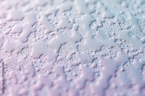 Macro Water Droplets on Frosted Surface with Pastel Gradient.
