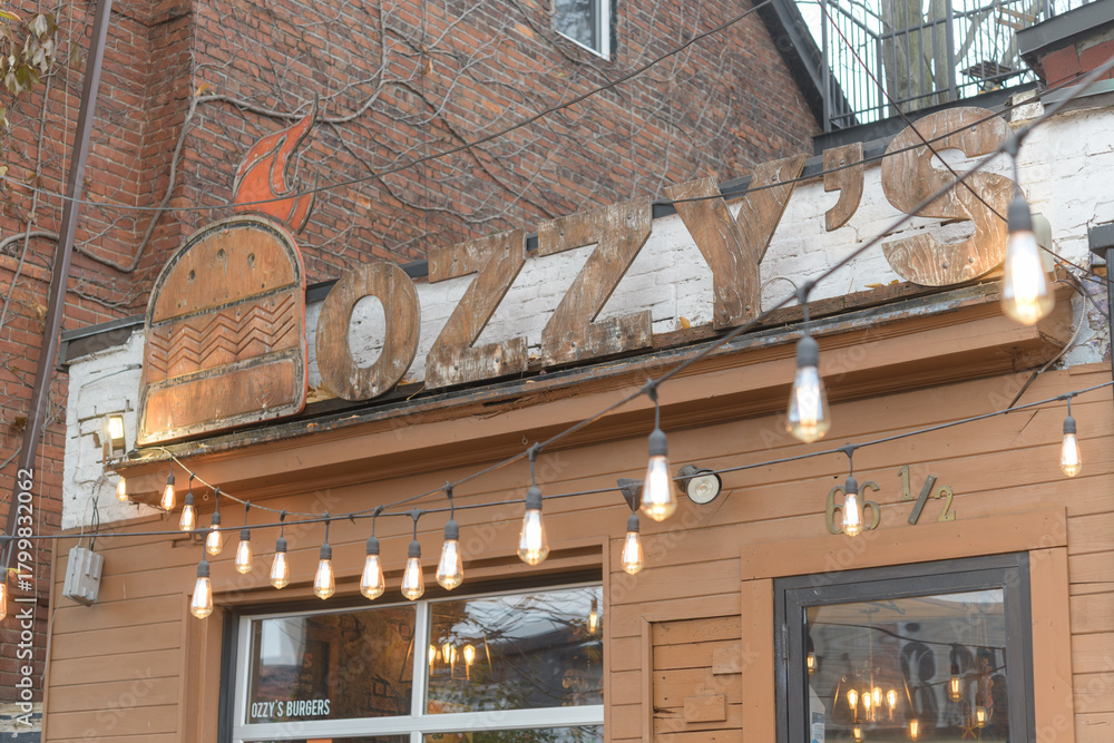 Fototapeta premium exterior of Ozzy's Burgers, a hamburger restaurant, located at 66 Nassau St, Toronto