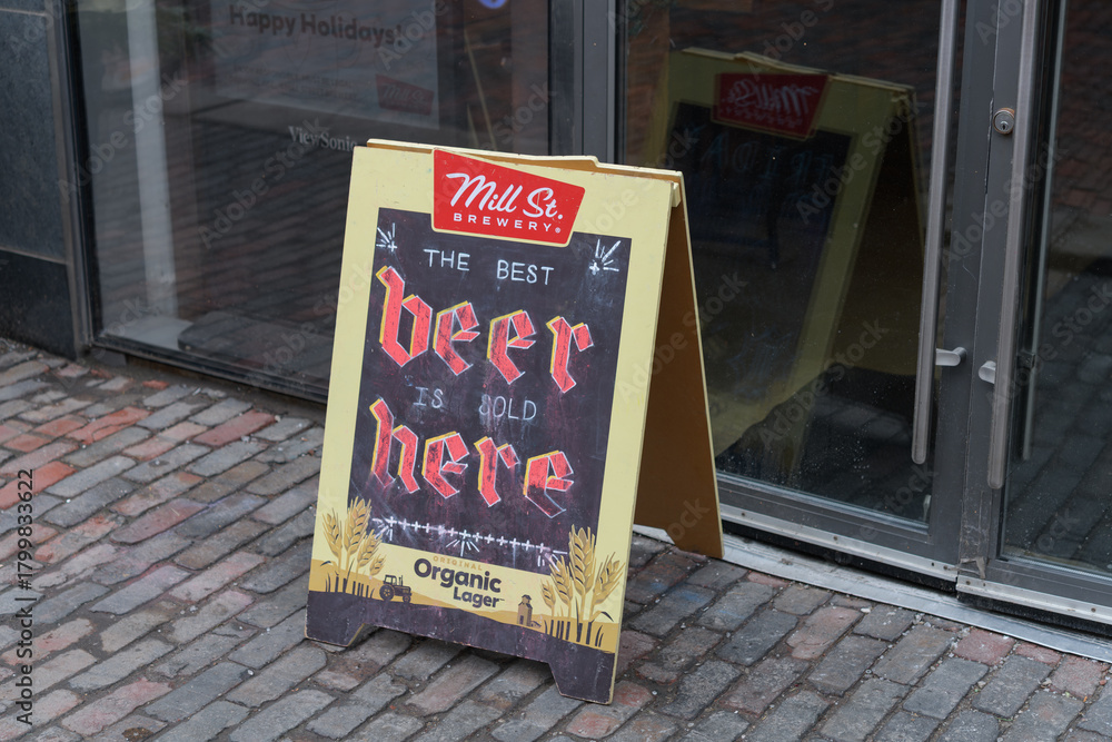 Naklejka premium Mill St brewery sidewalk sign at The Distillery Historic District, Toronto (21 Tank House Lane)