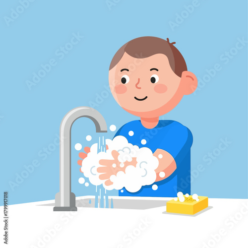 A young boy in a blue shirt washing his hands with soap and water at a sink to maintain good hygiene.