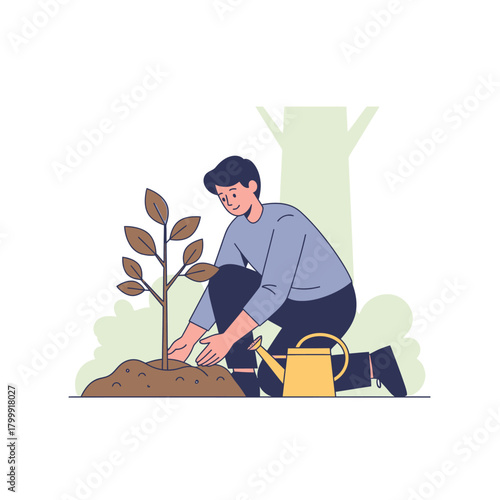 A young man carefully plants a new tree sapling in the ground to help the environment.