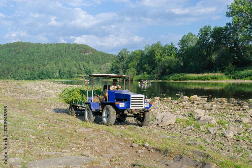 Fototapeta premium Beautiful view of a river winding through a canyon, with steep rocky walls and calm water. Soft natural light highlights textures and colors, creating a serene and dramatic landscape scene.