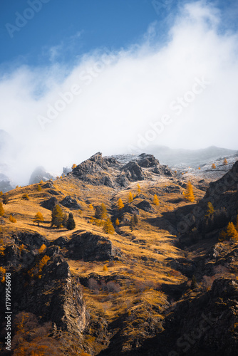 snow over the mountains during autumn season