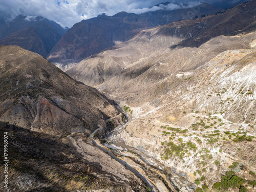 Huaraz, Peru: Aerial drone view above the road along the river Rio Santa flowing in valley of canon del pato in Huaraz region, Peru in the Andes mountain range