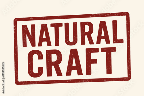Rectangular stamp NATURAL CRAFT condensed uppercase letters deep red ink fade texture