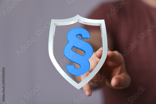 A hand holding a shield wit...