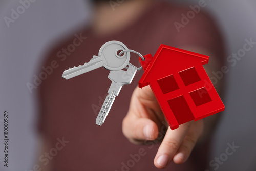 Hand showing a house key wi...
