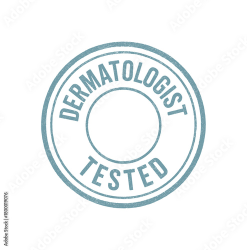 Round rubber stamp DERMATOLOGIST TESTED uppercase condensed font pale blue ink soft grain texture realistic pad style