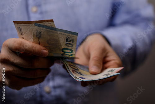 Close-up of a person counti...