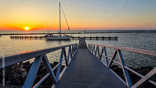 Canvas Print Sunset Reflections at the Marina with Sailboats and Pier