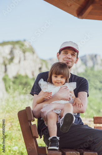 A father and a daughter are having a great time in nature


