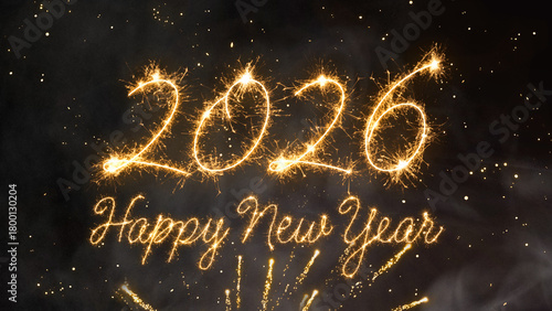 2026 Happy New Year with the number above the text, all formed by brilliant gold light on a deep black background with festive firework bursts and shining dust