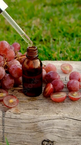 Grape seed extract in the garden. Selective focus.