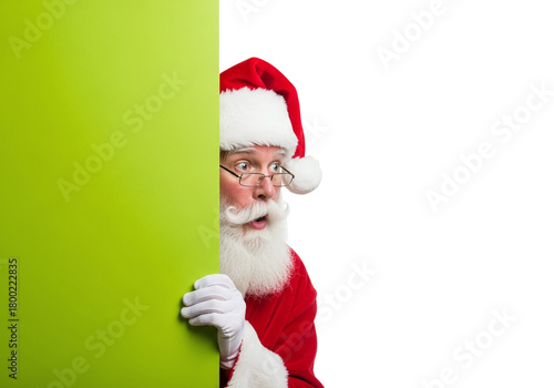 Santa Claus Peeking with a Surprised Look from Behind a Green Board