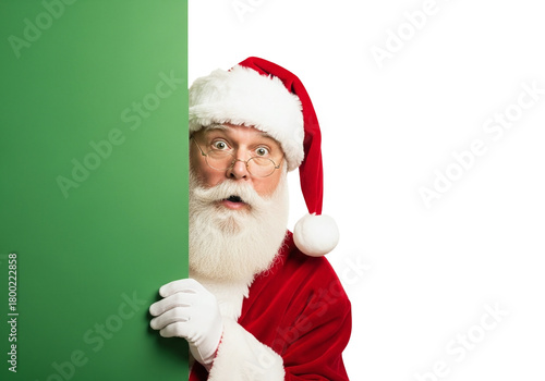 Santa Claus Peeking with a Surprised Look from Behind a Green Board