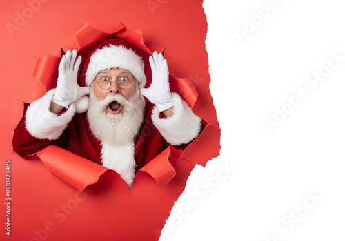Surprised Santa Claus Bursts Through Red Paper with Hands Up