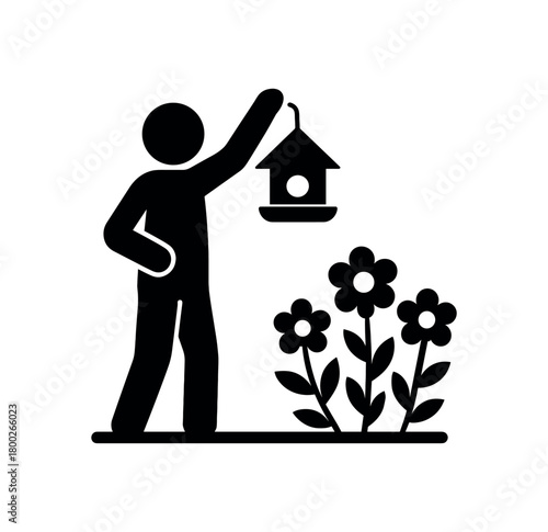 person hanging bird feeder near flowers flat black solid vector illustration isolated on white background