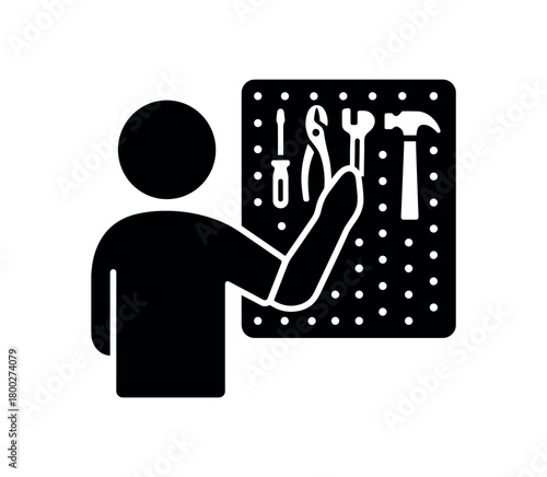 person arranging tools on pegboard flat black solid vector illustration isolated on white background
