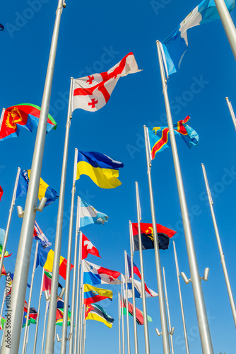 Georgian and Ukrainian flags waving together with the many international flags like DR Congo, Bosnia, Eritrea, Panama, Argentina, Angola, in Doha, Qatar.