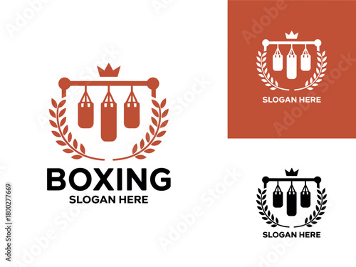 Vintage boxing logo with punching bags and laurel wreath for sports club or gym