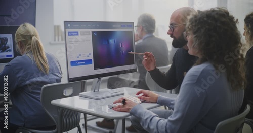 Young Teacher Guiding Adult Female Student Craft Effective Prompts For AI Image Generation During Digital Art Lesson. Man Analyzes Futuristic City Image on Screen. Concept of AI Education, Creativity.