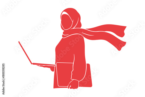 Woman in hijab and scarf using a laptop