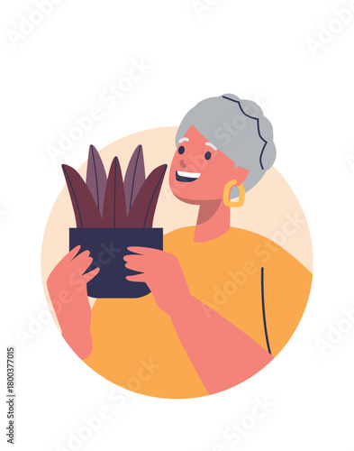 Elderly woman proud of houseplant