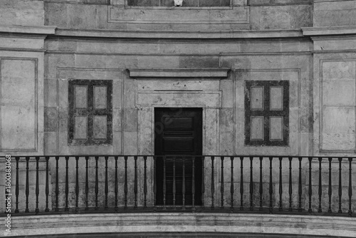 Symmetrical Facade with Door and Balcony in Black and White