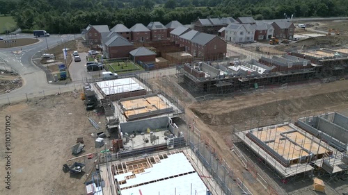 Construction of new homes in suburb with multiple building sites and progress updates visible at Miller Homes, in Catterick Garrison, UK.