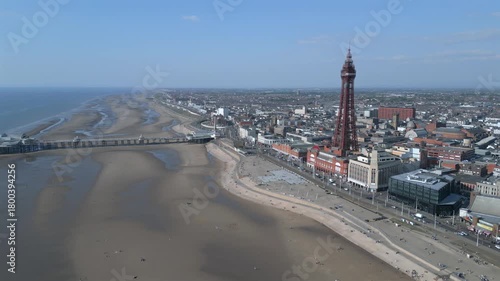 Exploring Blackpool's sandy beach and iconic tower on a sunny day in early spring