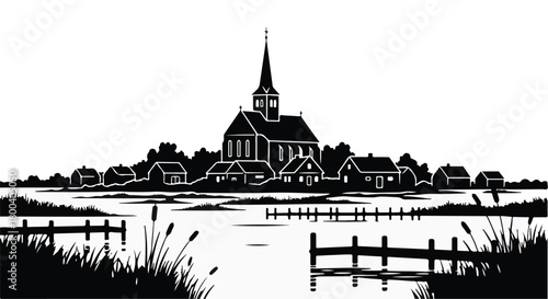 Charming village with church and spire nestled beside a tranquil body of water.
