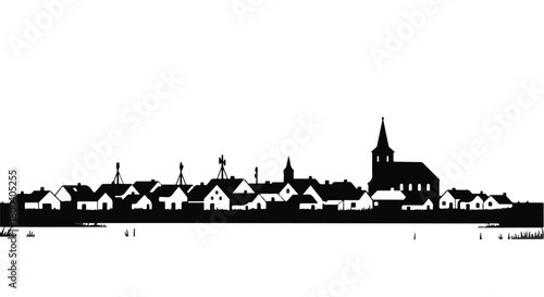Charming village skyline with church spire against a bright sky