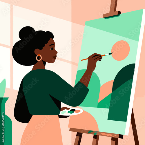 Young Black woman painting on canvas in a bright indoor studio  