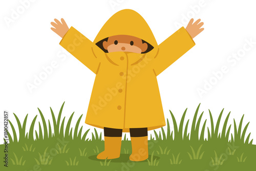 A young child, anonymous, stands in a grassy field, hiding beneath a raincoat with arms raised and nose peeking out; Melbourne, Victoria, Australia