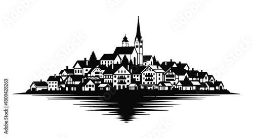 Charming European village silhouette nestled on a hillside with a prominent church spire.