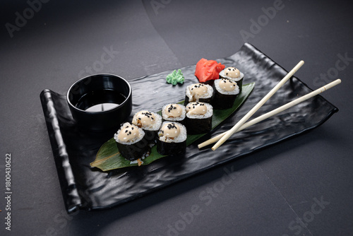 Japanese rolls, fish, black background
