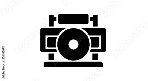 Sleek monochrome icon of an industrial processing machine, featuring a central rotating disk and an upper material roller, symbolizing manufacturing, production, and mechanical operations