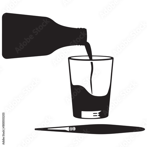 Liquid being poured from a bottle into a glass with a paintbrush below
