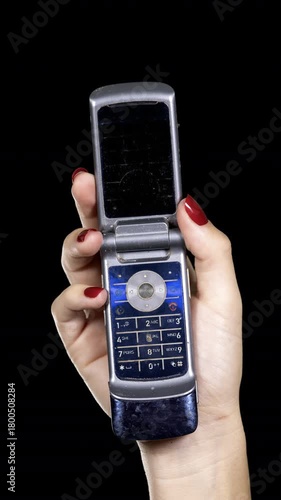 Wallpaper Mural hand holding a sequence of old mobile phones Torontodigital.ca