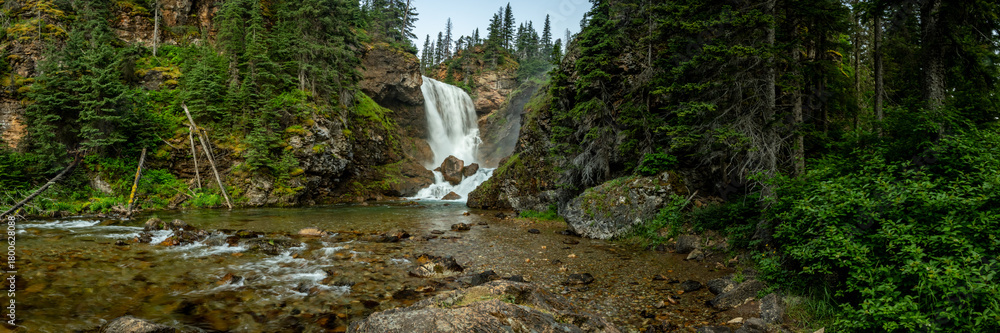Fototapeta premium Panorama Of Dawn Mist Falls From Below In Glacier